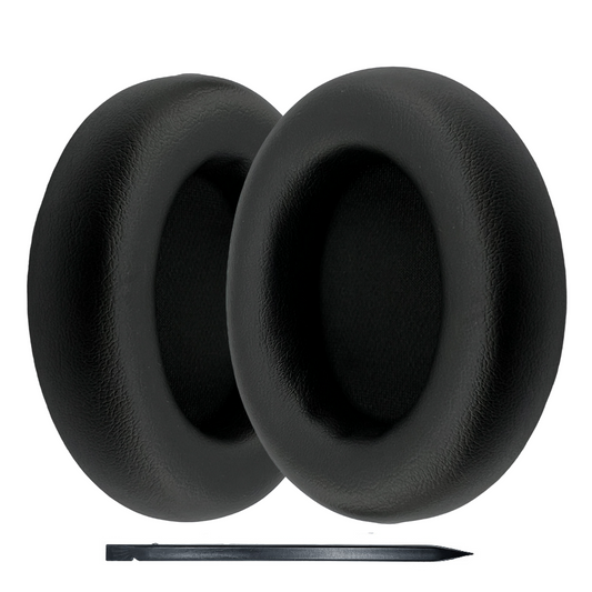 Black earbud covers with a small tool on a white background
